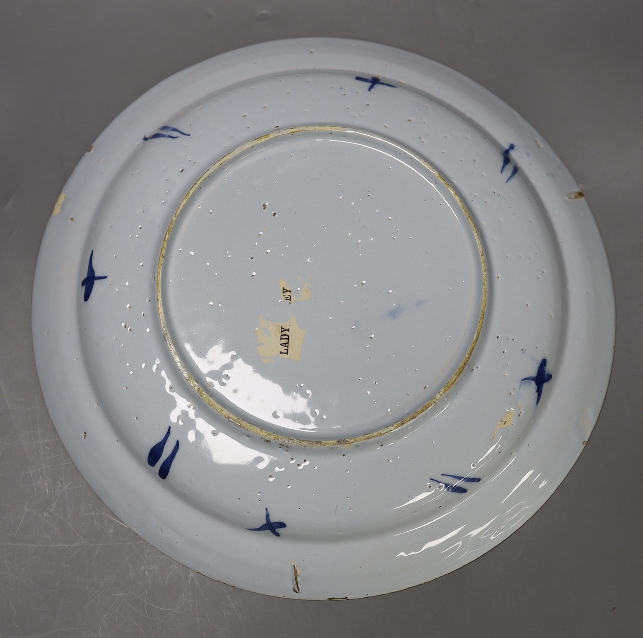 A pair of mid 18th century Delft blue and white chargers, 33.5cm diameter